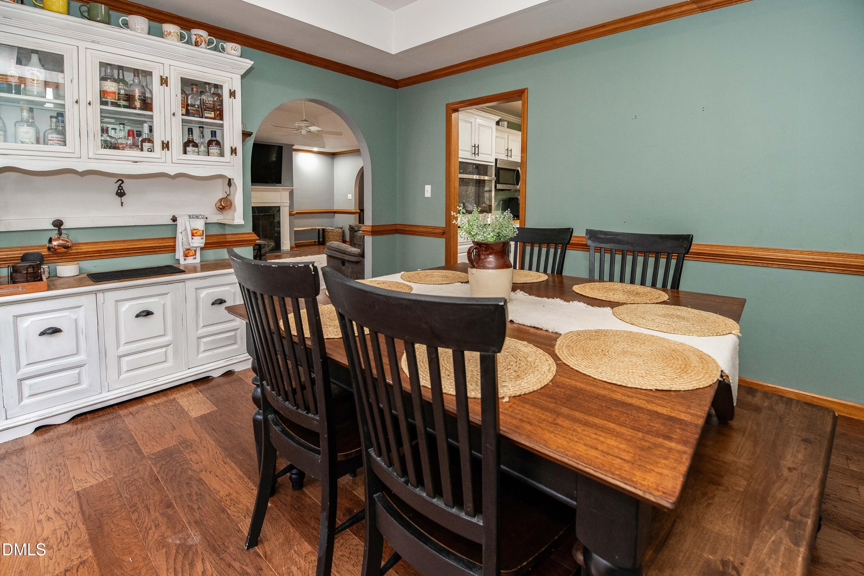 123 Chris Court Garner, NC 27529 - Photo 6 of 24 a view of a dining room with furniture window and wooden floor
