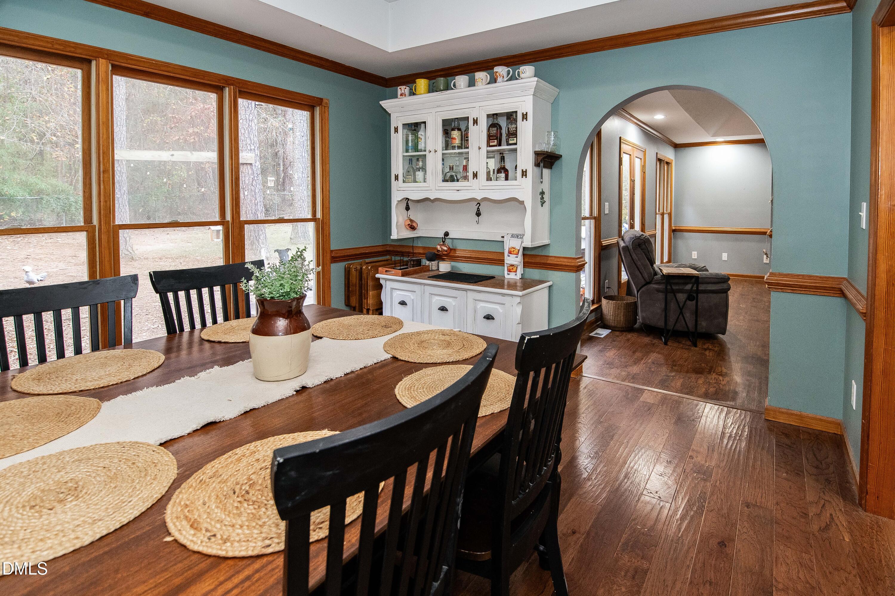 123 Chris Court Garner, NC 27529 - Photo 7 of 24 a view of a dining room with furniture and a large window