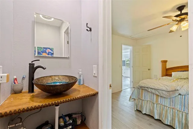 a bedroom with a bed and a view of bathroom