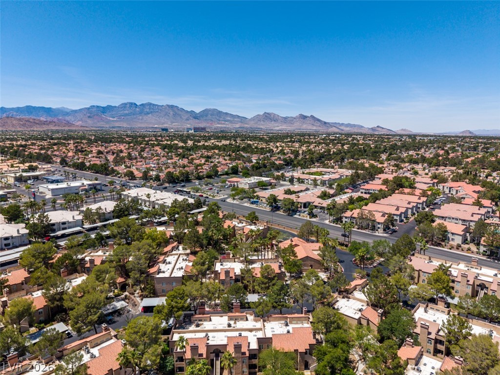 9325 West Desert Inn Road, Unit 244 Las Vegas, NV 89117 - Photo 46 of 55 Vast urban landscape with distant mountains, offering a picturesque and serene living experience.