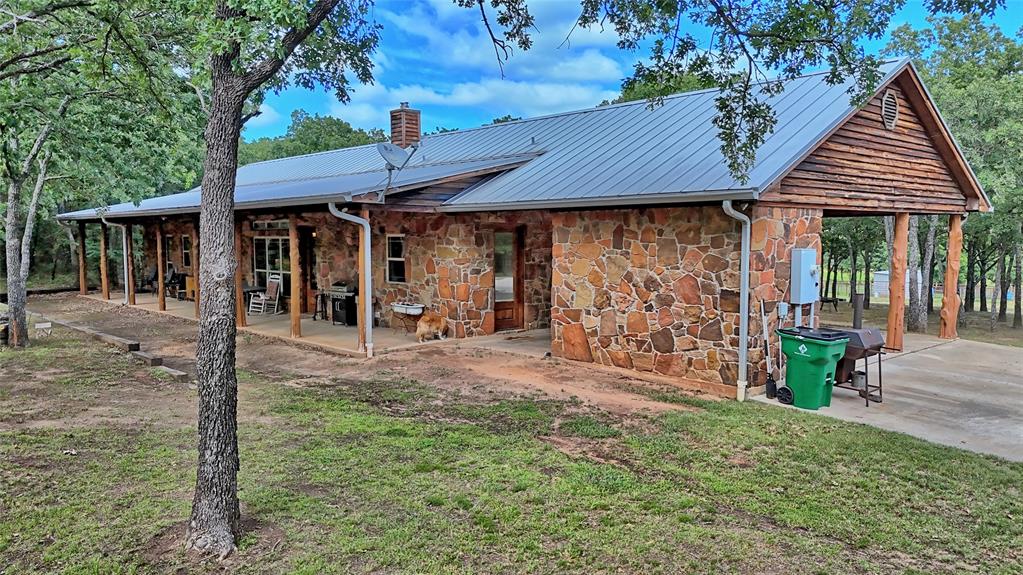 4509 Lazy E Road St. Jo, TX 76265 - Photo 25 of 39 a view of a house with backyard and sitting area