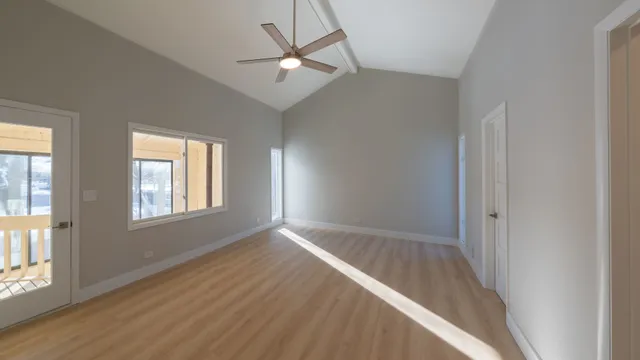 a spacious bathroom with a double vanity sink a mirror and a