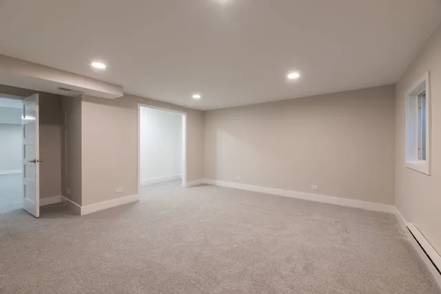 a bedroom with a large bed and a couch