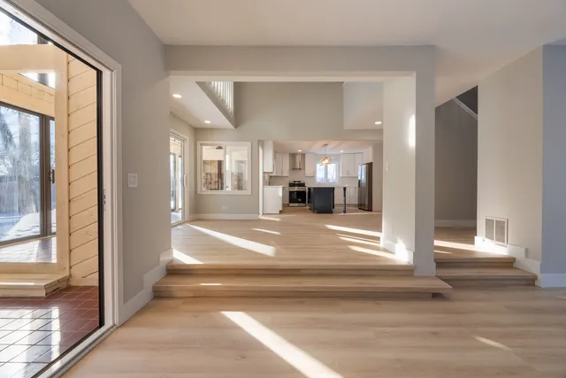 a kitchen with a stove a sink and a refrigerator