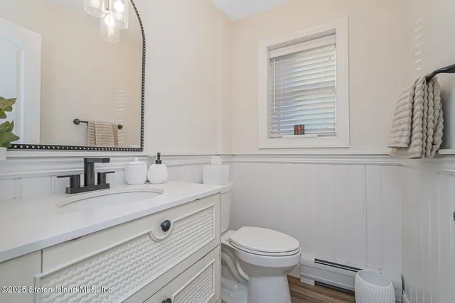 a kitchen with cabinets and chairs