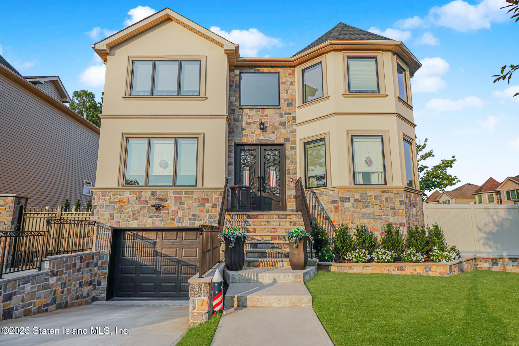 239 Vernon Avenue Staten Island, NY 10309 - Photo 2 of 67 a front view of a house with a garden