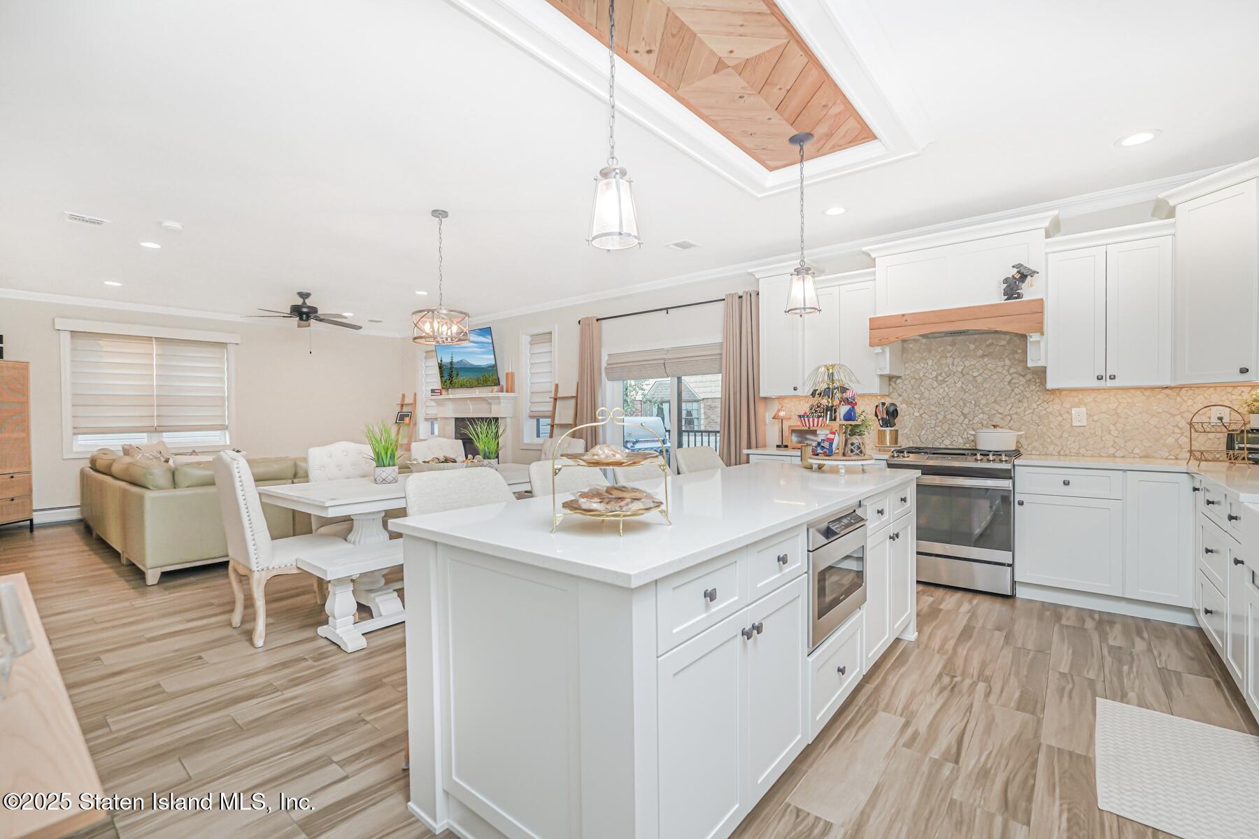 239 Vernon Avenue Staten Island, NY 10309 - Photo 21 of 67 a kitchen with a sink and wooden floor