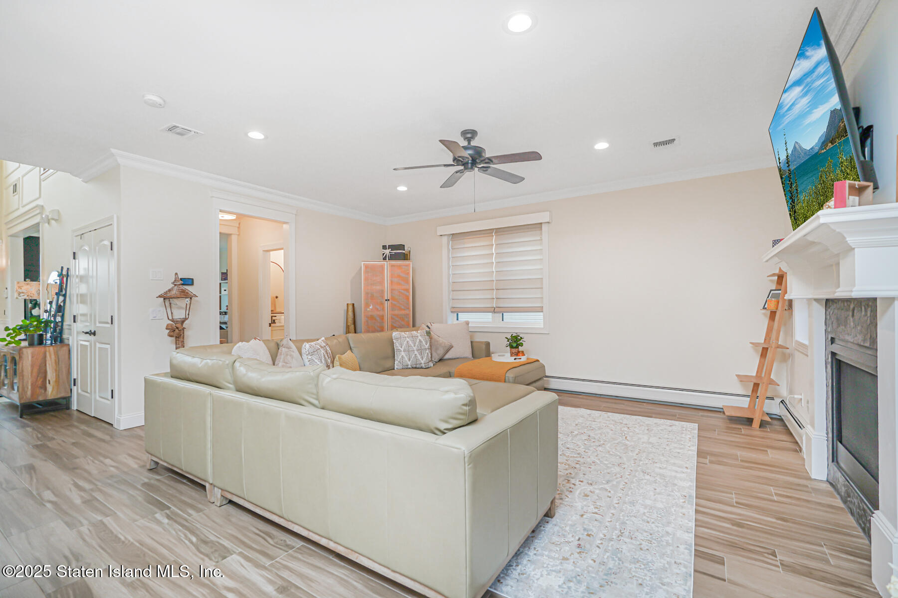 239 Vernon Avenue Staten Island, NY 10309 - Photo 27 of 67 a living room with furniture and a wooden floor