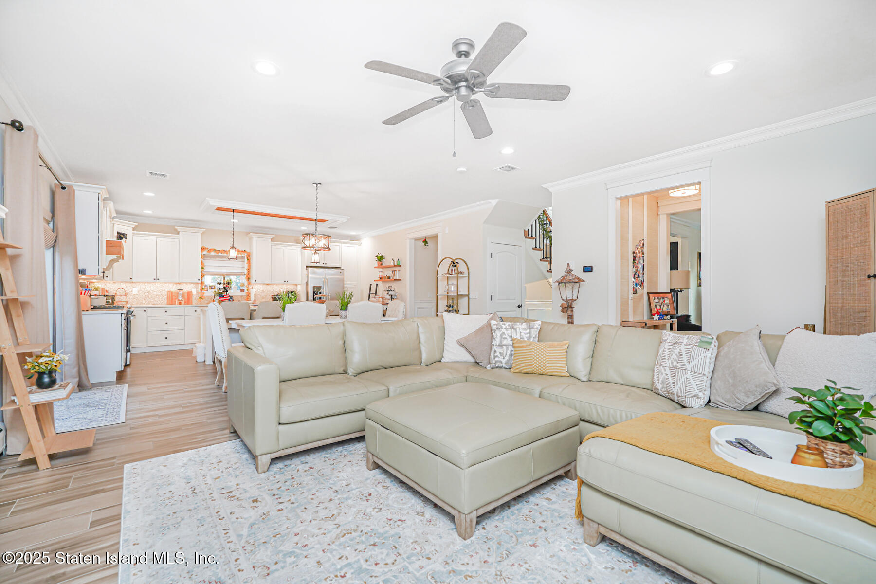 239 Vernon Avenue Staten Island, NY 10309 - Photo 28 of 67 a living room with furniture kitchen view and a chandelier