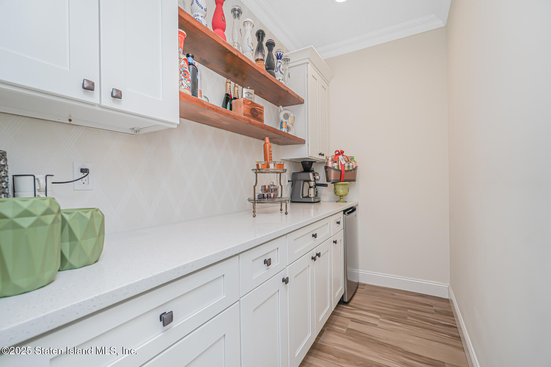 239 Vernon Avenue Staten Island, NY 10309 - Photo 29 of 67 a kitchen with white cabinets and sink