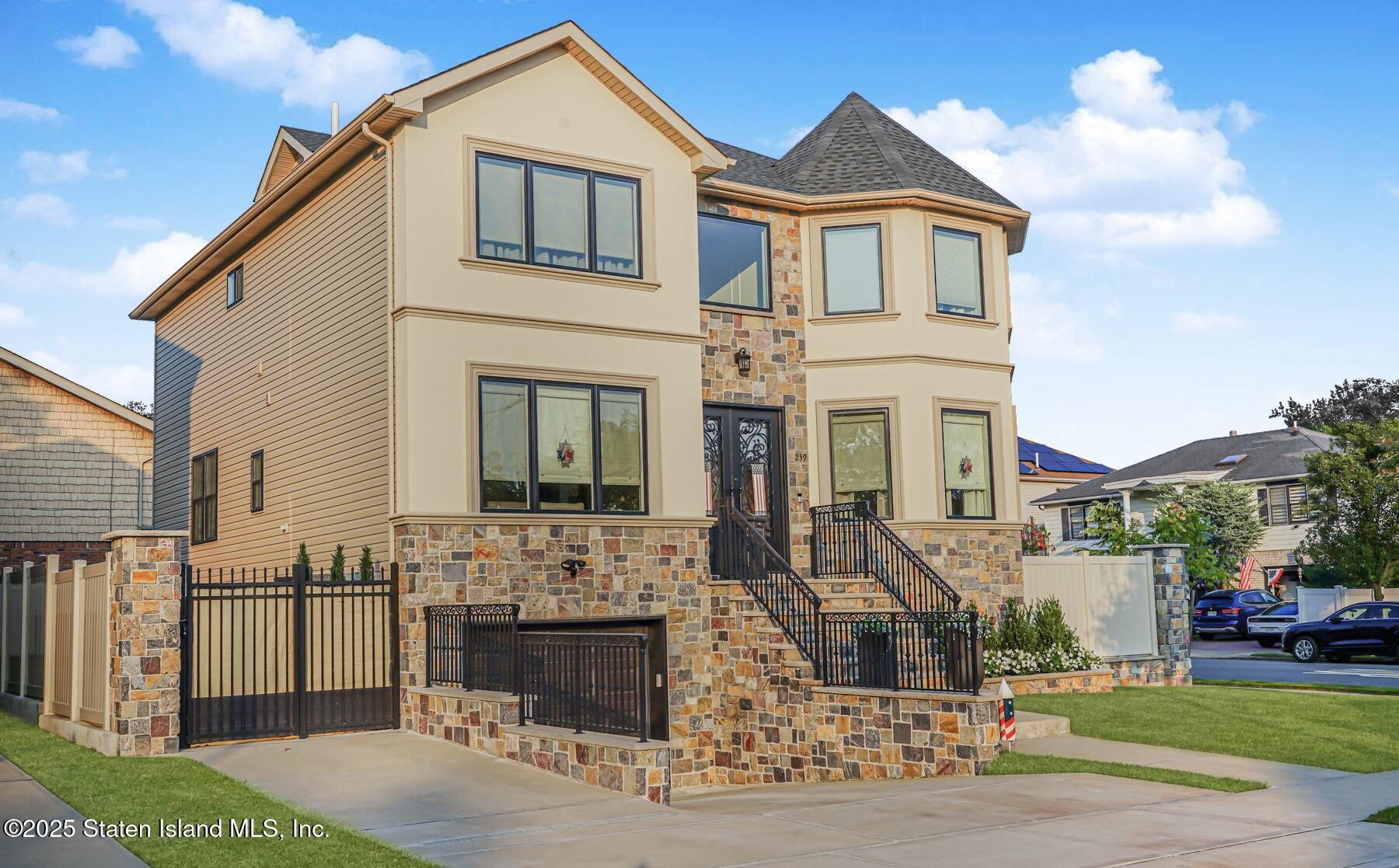 239 Vernon Avenue Staten Island, NY 10309 - Photo 3 of 67 a view of a white house with a yard and plants
