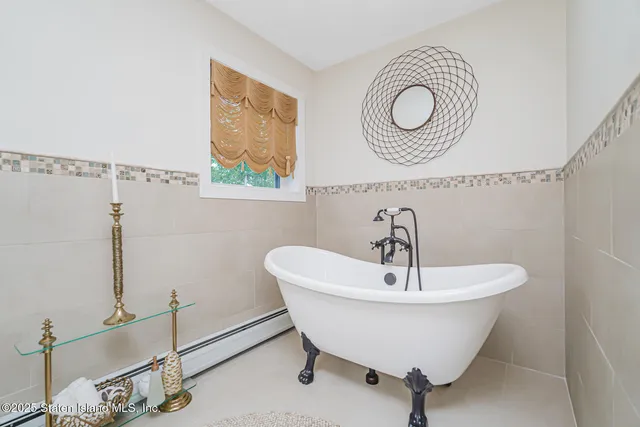 a living room with a fireplace furniture and a potted plant