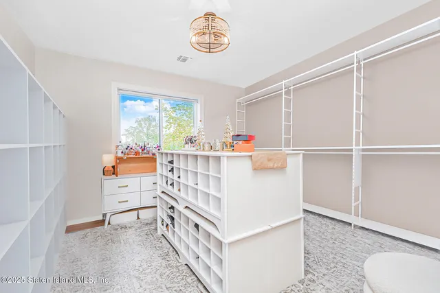 a view of a livingroom with furniture and a fireplace