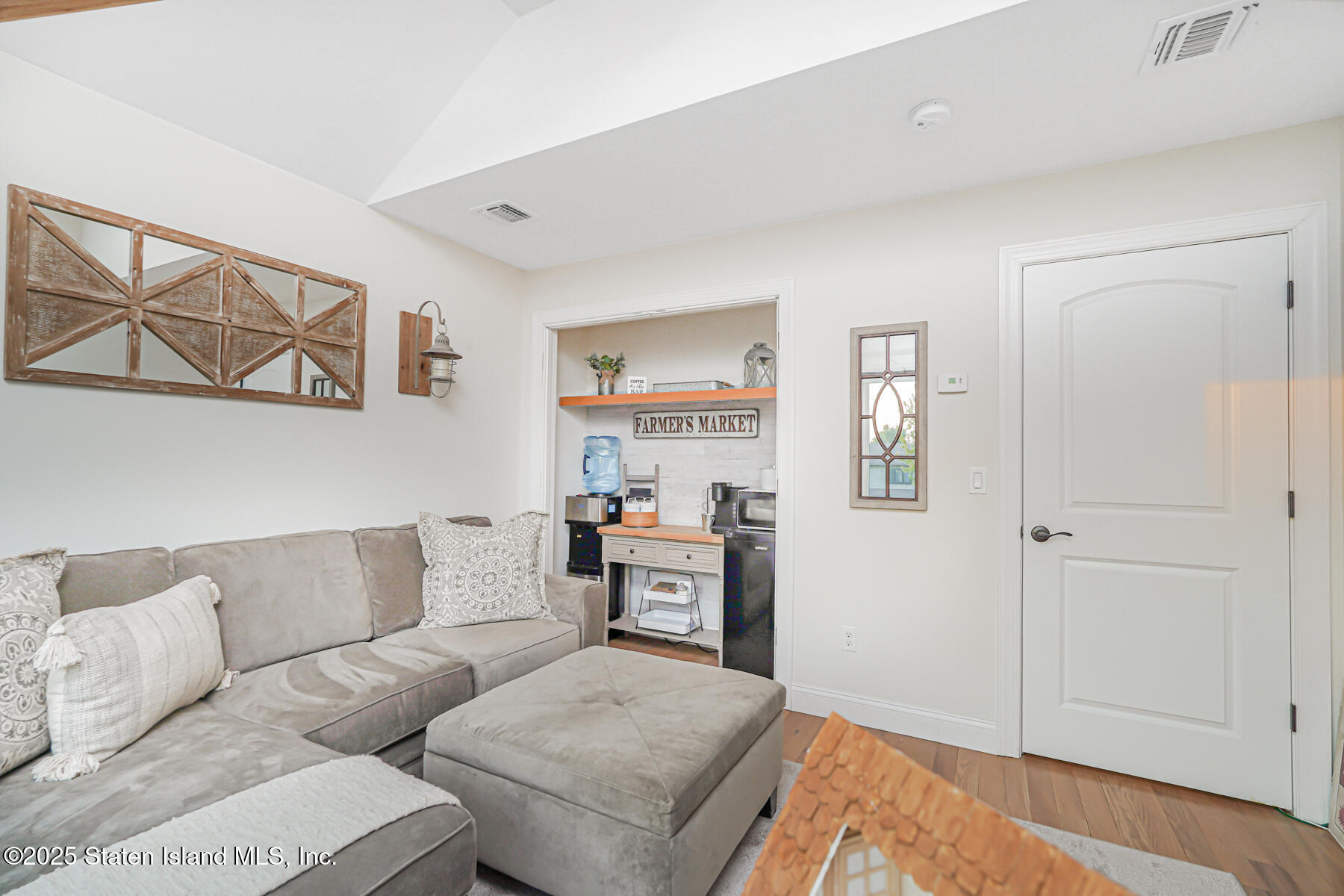 239 Vernon Avenue Staten Island, NY 10309 - Photo 42 of 67 a living room with furniture and painting on the wall