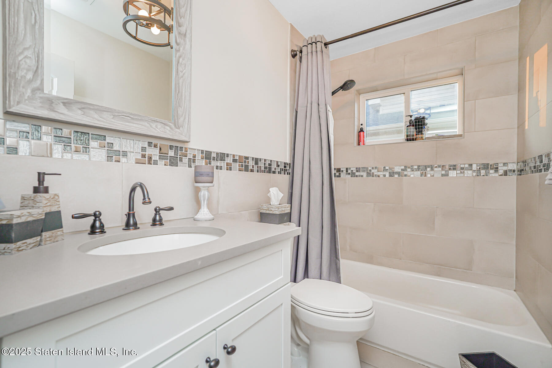 239 Vernon Avenue Staten Island, NY 10309 - Photo 44 of 67 a bathroom with a sink a toilet and a mirror
