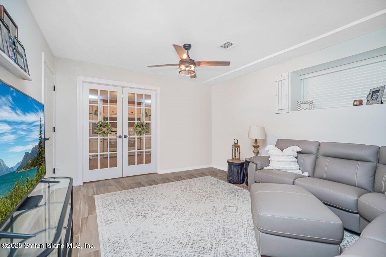 239 Vernon Avenue Staten Island, NY 10309 - Photo 46 of 67 a living room with furniture and a window