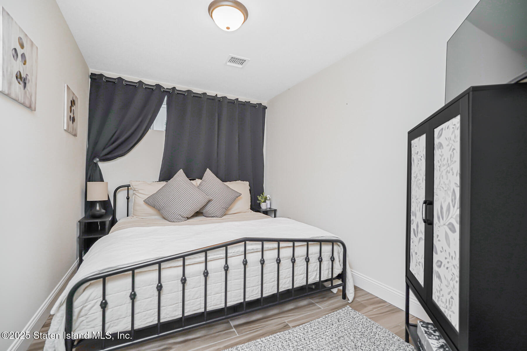 239 Vernon Avenue Staten Island, NY 10309 - Photo 51 of 67 a bedroom with a bed and a window