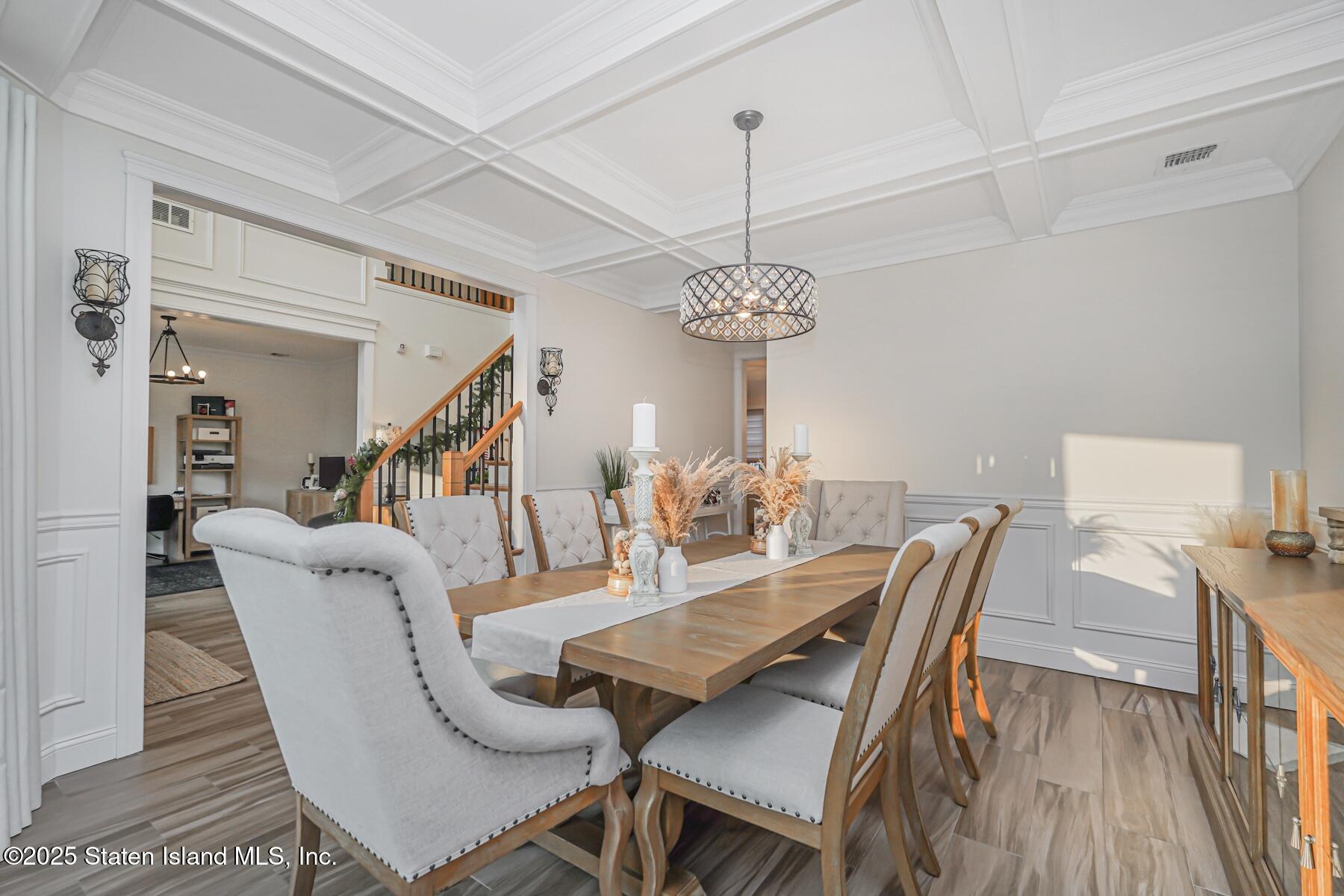 239 Vernon Avenue Staten Island, NY 10309 - Photo 9 of 67 a view of a dining room with furniture wooden floor and chandelier