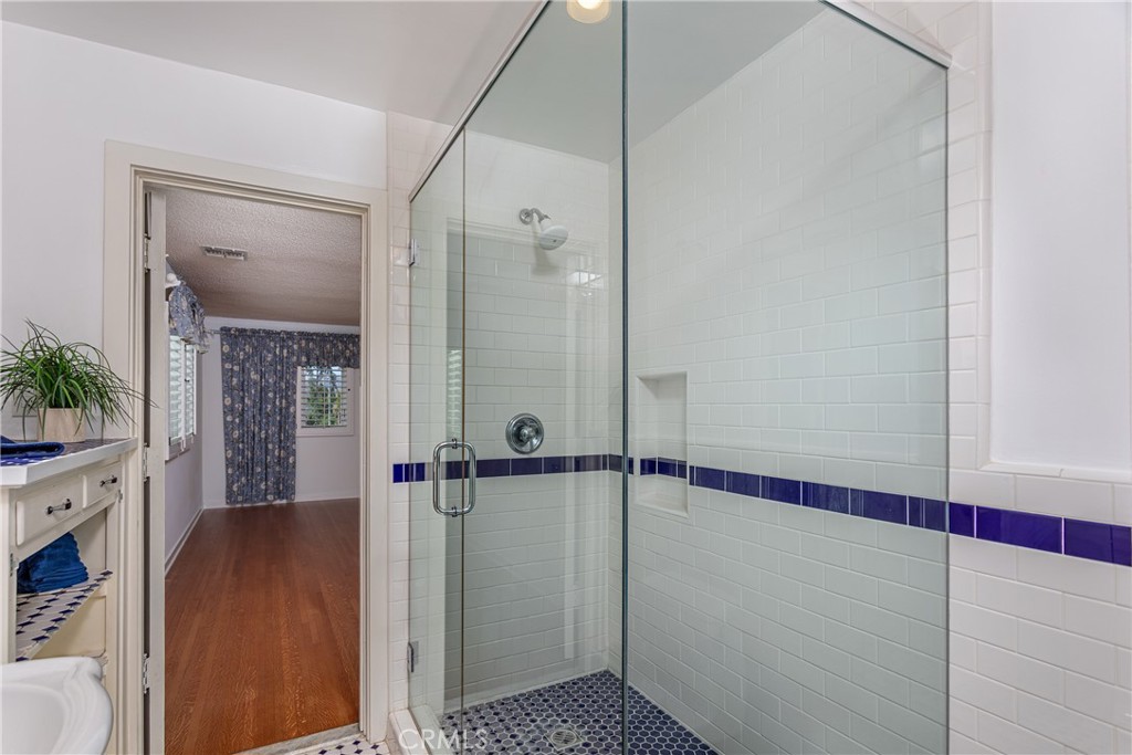 590 Bethany Road Burbank, CA 91504 - Photo 25 of 58 a bathroom with a shower and a sink