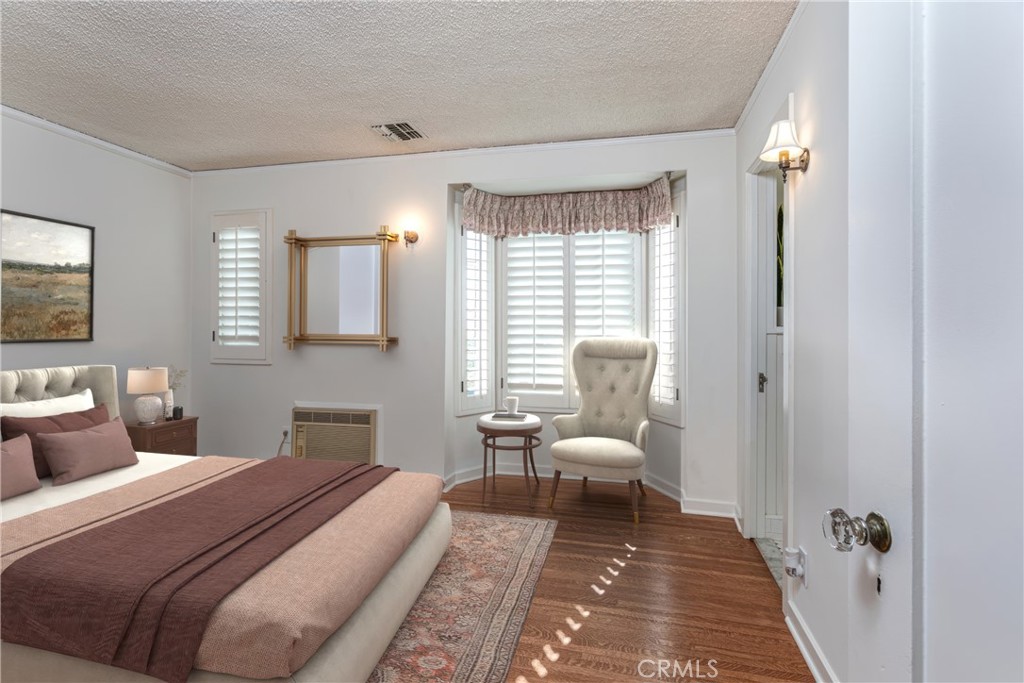 590 Bethany Road Burbank, CA 91504 - Photo 30 of 58 a bedroom with a bed and wooden floor