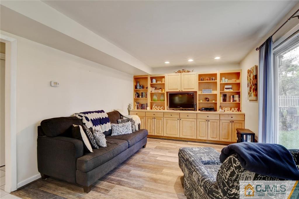 14 Drake Road Somerset, NJ 08873 - Photo 13 of 25 a living room with furniture and a flat screen tv