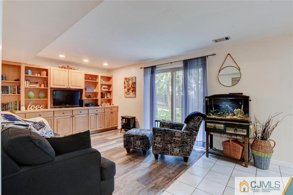 14 Drake Road Somerset, NJ 08873 - Photo 14 of 25 a living room with furniture and a flat screen tv
