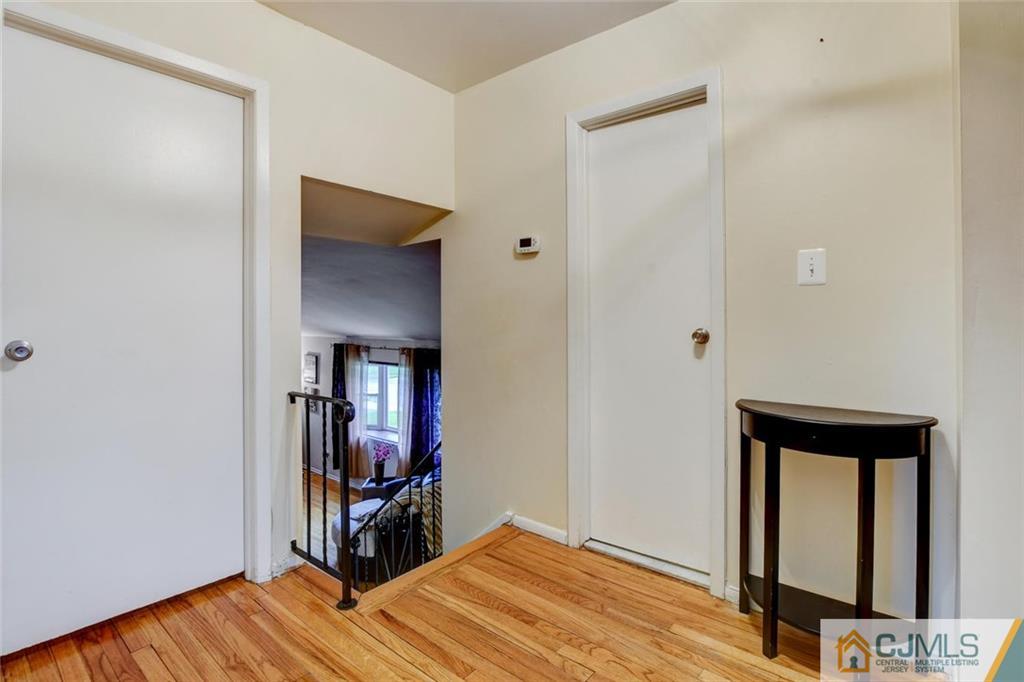 14 Drake Road Somerset, NJ 08873 - Photo 15 of 25 a view of a livingroom with wooden floor and closet