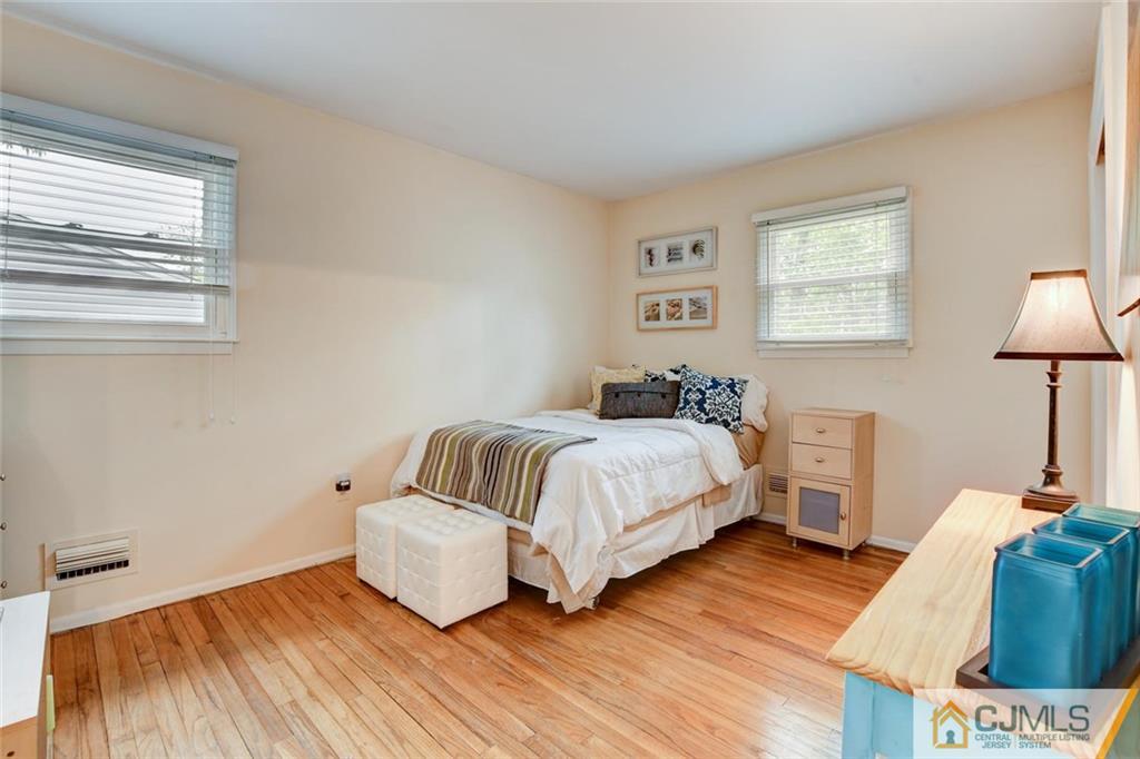 14 Drake Road Somerset, NJ 08873 - Photo 18 of 25 a bedroom with a bed and a night stand