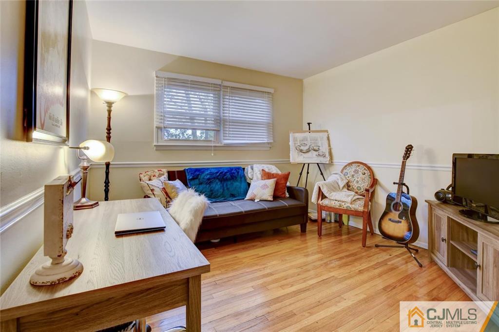14 Drake Road Somerset, NJ 08873 - Photo 22 of 25 a living room with furniture and a flat screen tv