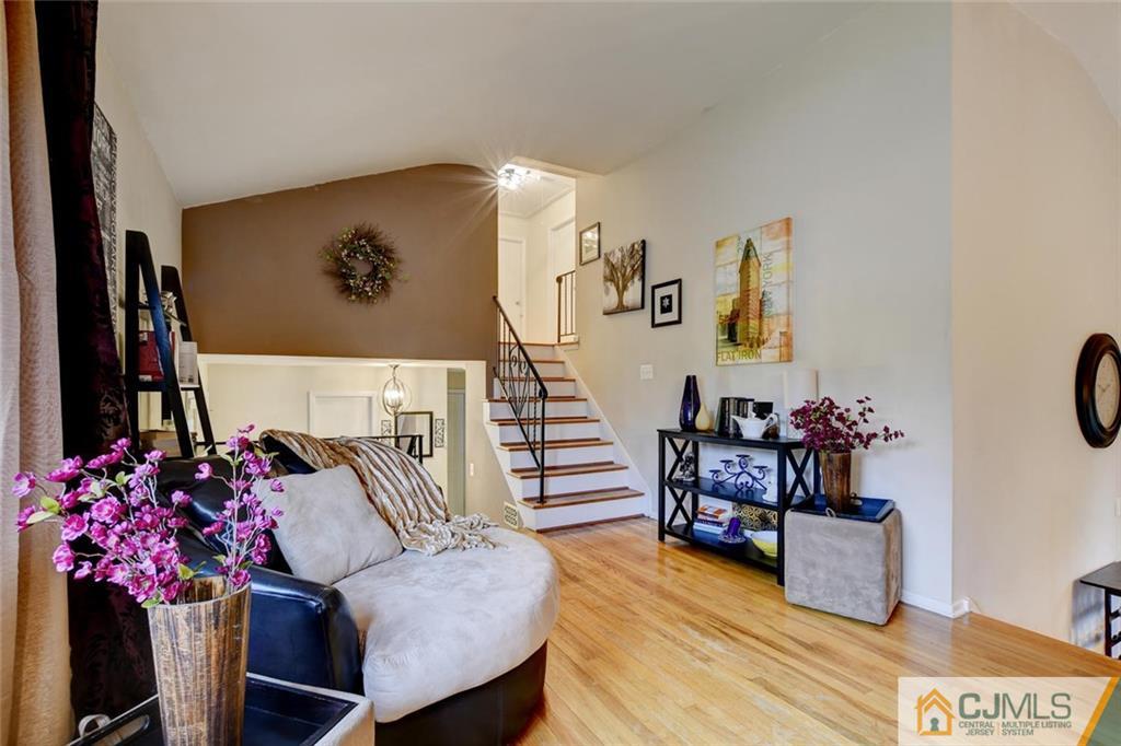 14 Drake Road Somerset, NJ 08873 - Photo 4 of 25 a living room with furniture and flowers