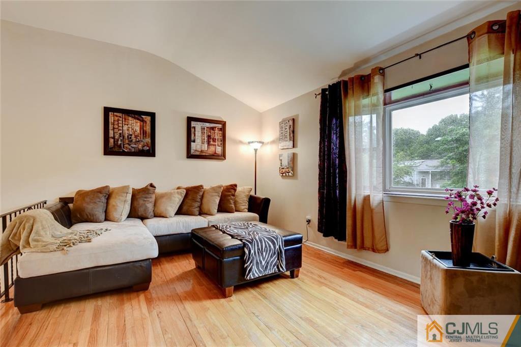 14 Drake Road Somerset, NJ 08873 - Photo 5 of 25 a living room with furniture and a large window