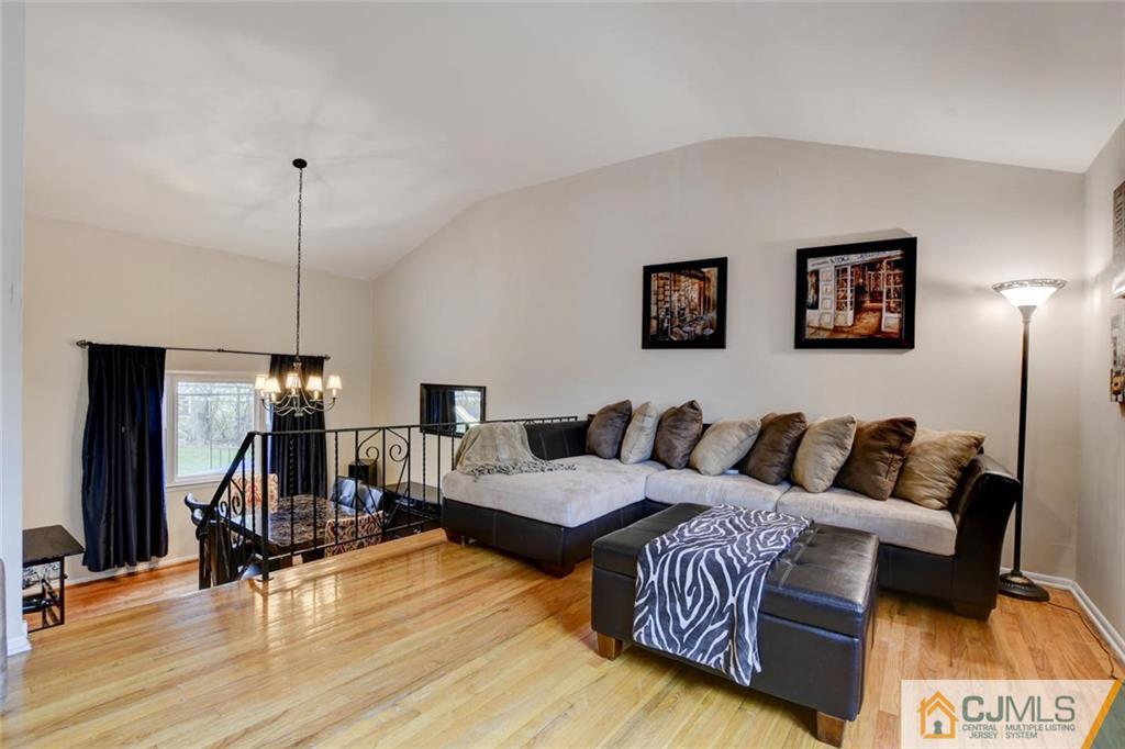 14 Drake Road Somerset, NJ 08873 - Photo 6 of 25 a living room with furniture and a wooden floor