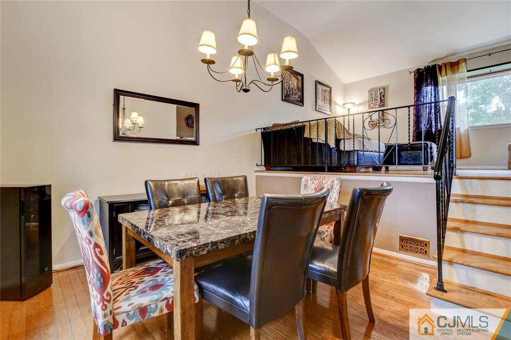 14 Drake Road Somerset, NJ 08873 - Photo 7 of 25 a view of a dining room with furniture and a chandelier