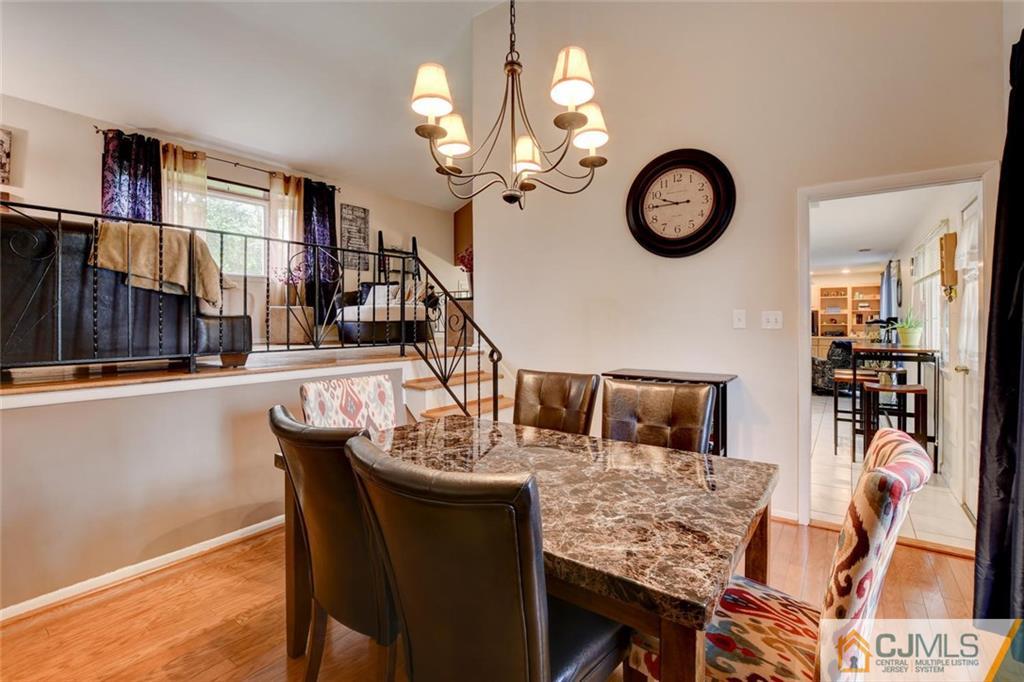 14 Drake Road Somerset, NJ 08873 - Photo 8 of 25 a view of a dining room with furniture and a chandelier