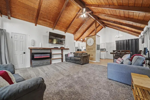 a living room with furniture and a clock