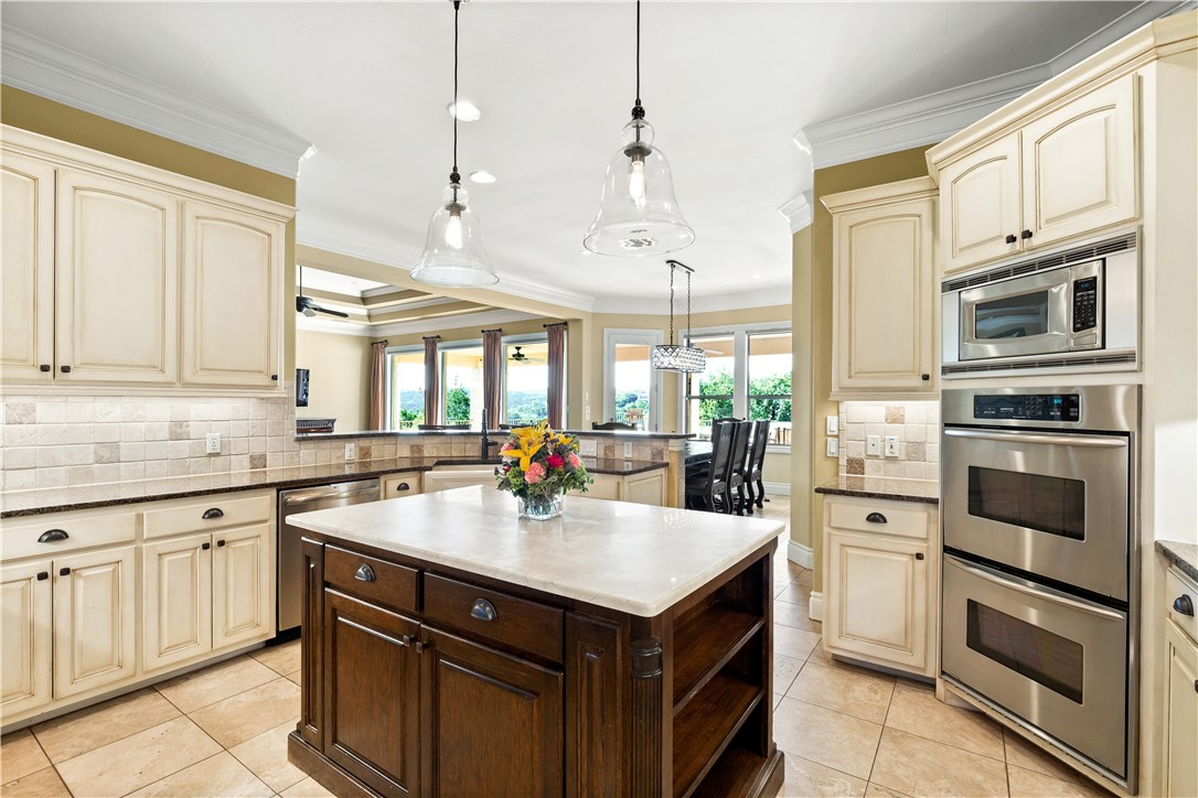 3314 Far View Drive Austin, TX 78730 - Photo 1 of 1 a kitchen with a sink stove and microwave