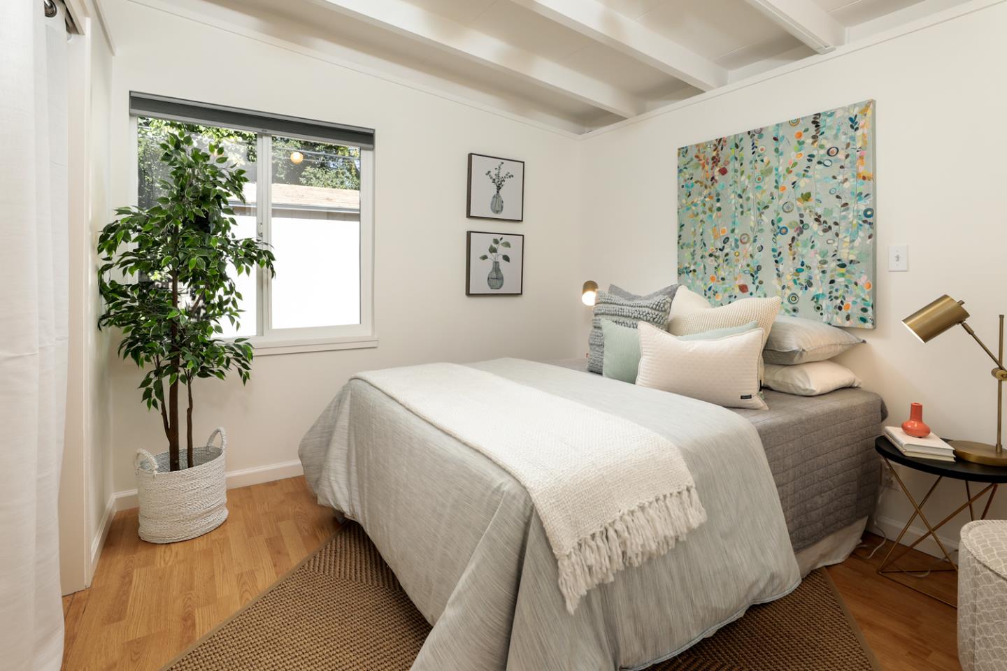 2312 Jane Lane Mountain View, CA 94043 - Photo 15 of 23 a bedroom with a large bed and a potted plant