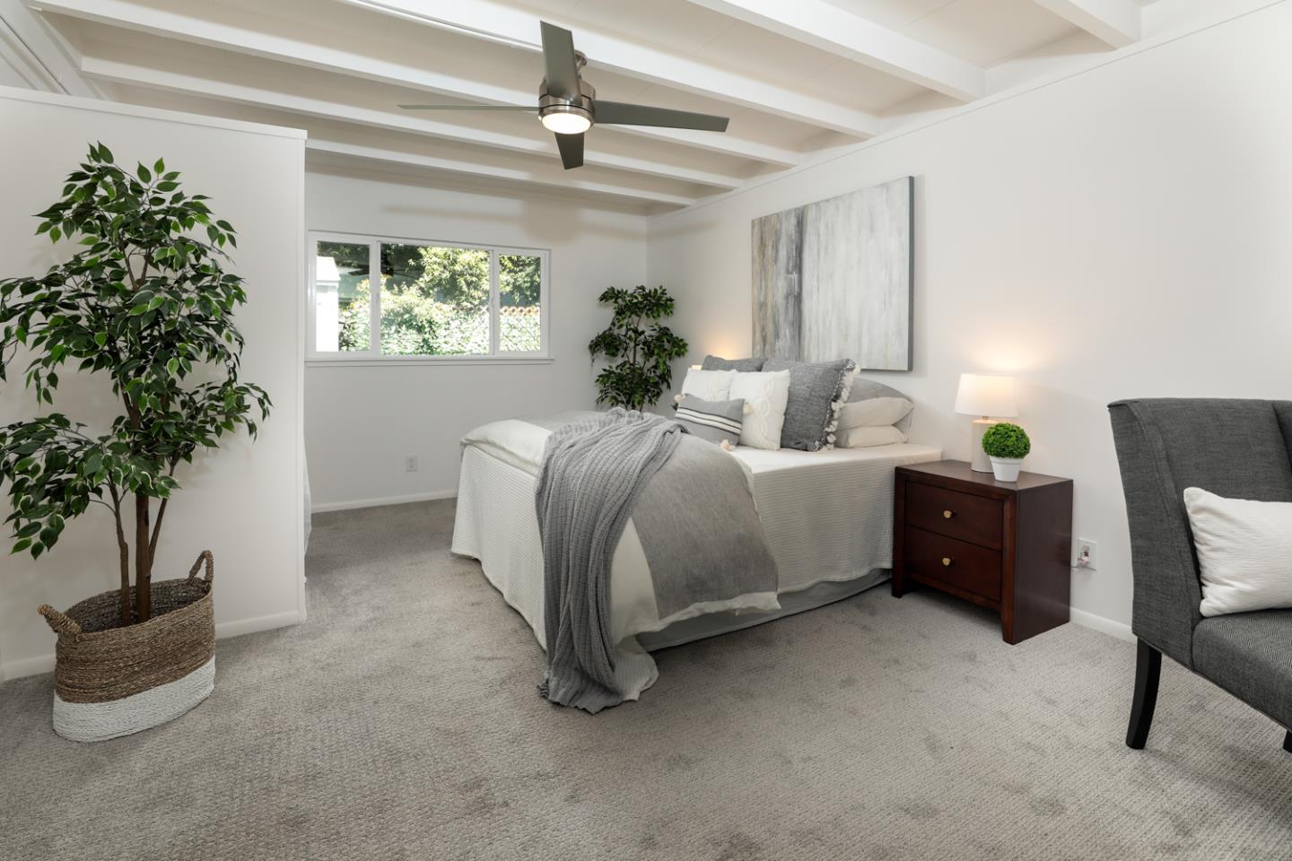 2312 Jane Lane Mountain View, CA 94043 - Photo 16 of 23 a bedroom with a bed and a potted plant