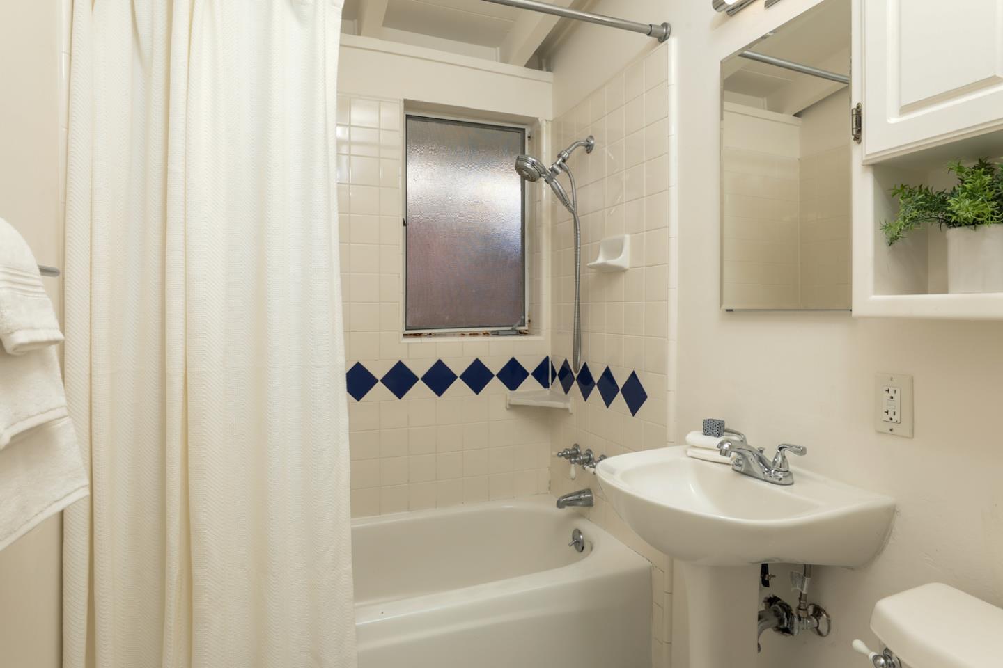 2312 Jane Lane Mountain View, CA 94043 - Photo 17 of 23 a bathroom with a sink and a mirror