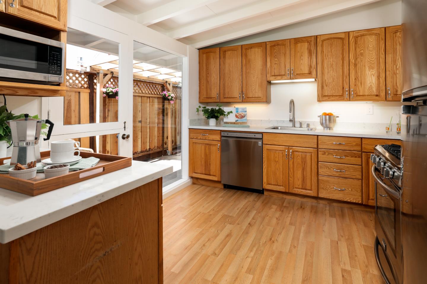 2312 Jane Lane Mountain View, CA 94043 - Photo 10 of 23 a kitchen with stainless steel appliances granite countertop a sink stove and wooden cabinets
