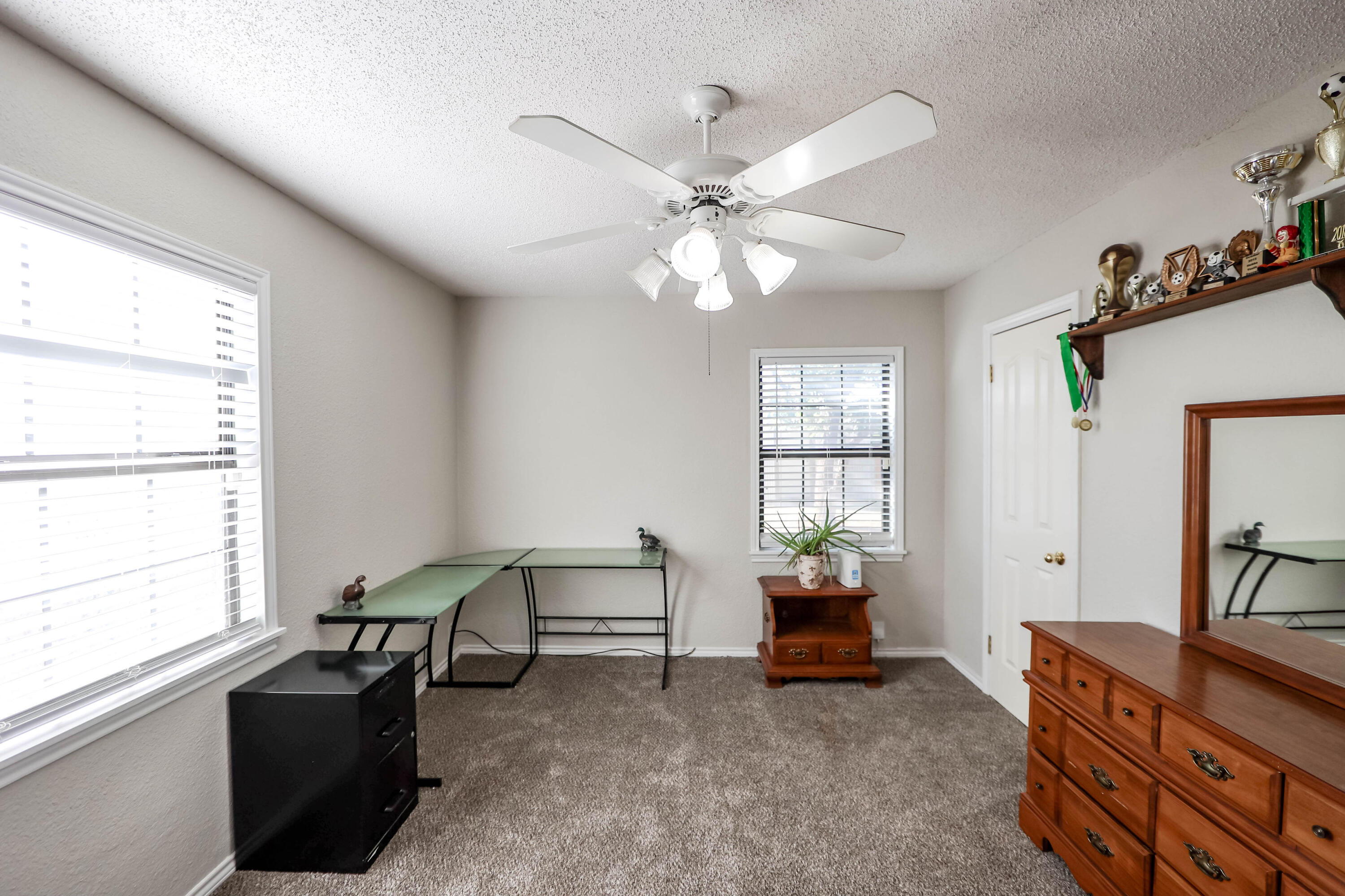 4607 33rd Street Lubbock, TX 79410 - Photo 11 of 22 a living room with furniture and a window