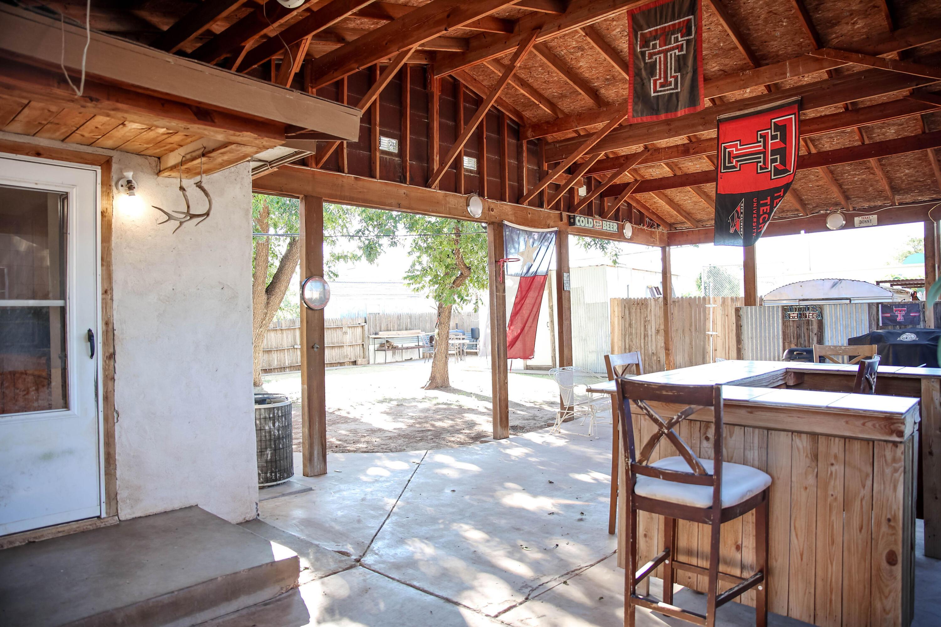 4607 33rd Street Lubbock, TX 79410 - Photo 14 of 22 a view of a chairs and table in a patio