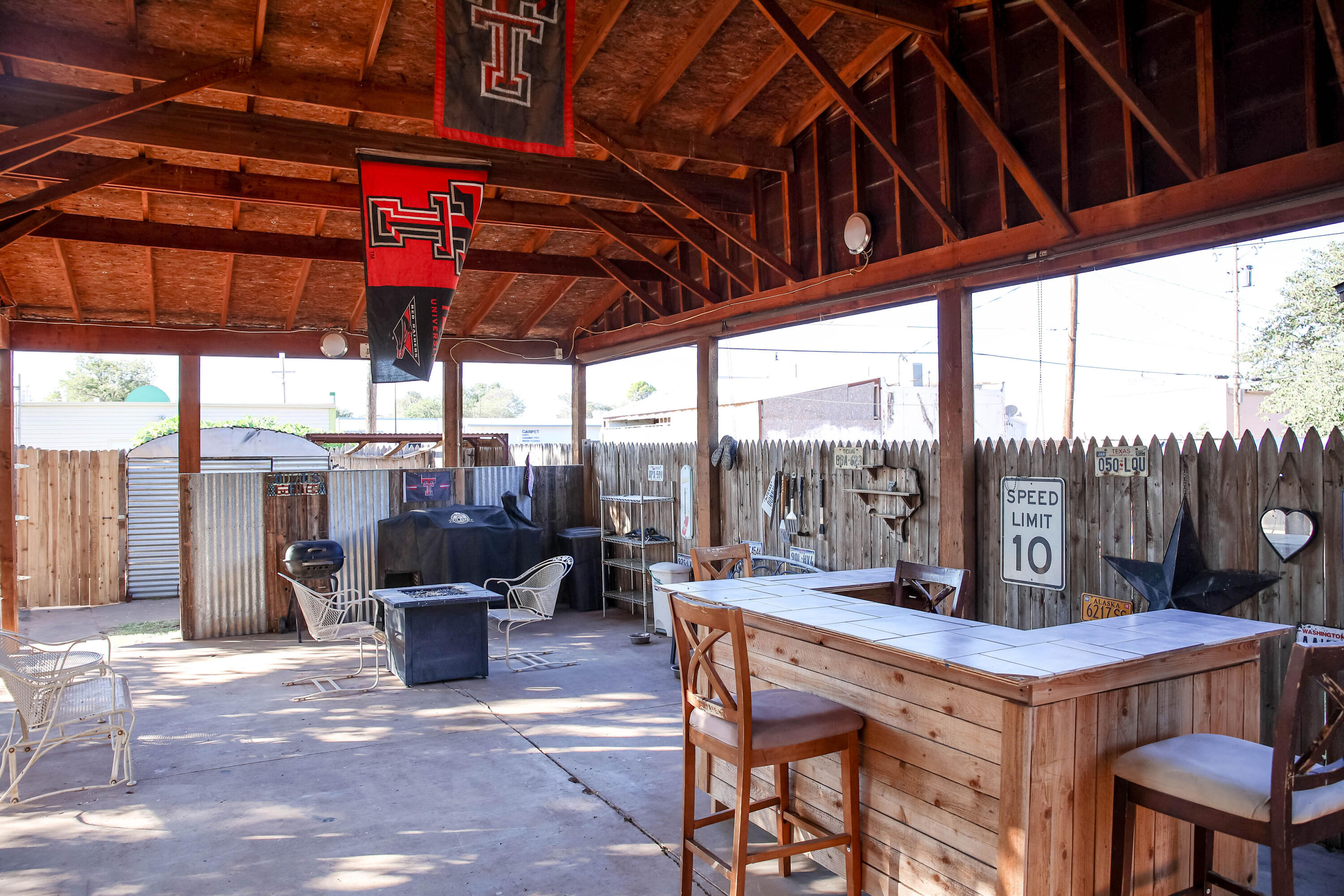 4607 33rd Street Lubbock, TX 79410 - Photo 15 of 22 a view of a patio with a table and chairs