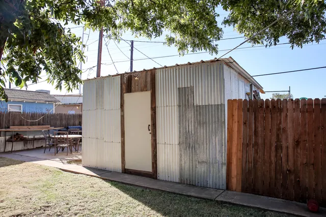 a outdoor space with lots of tables a chair and a couch