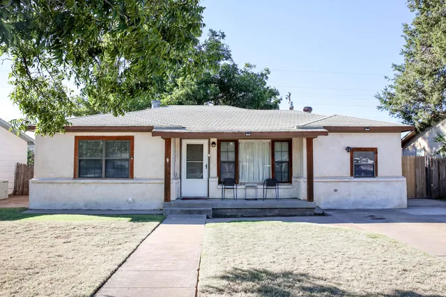 a front view of a house with yard
