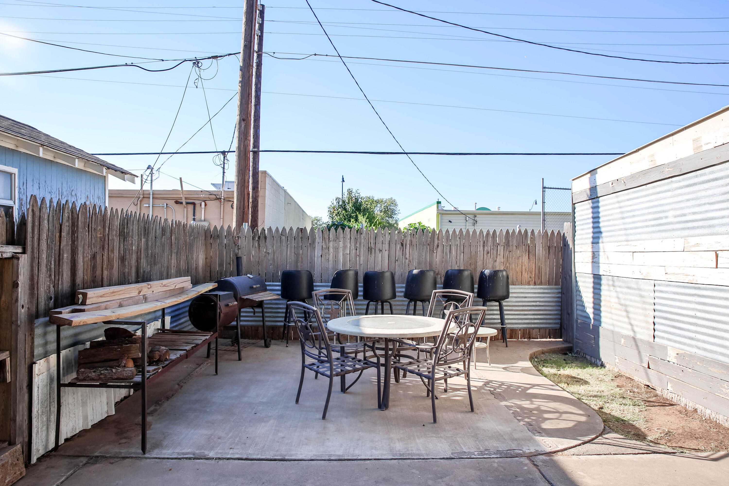 4607 33rd Street Lubbock, TX 79410 - Photo 21 of 22 a outdoor space with lots of tables a chair and a couch