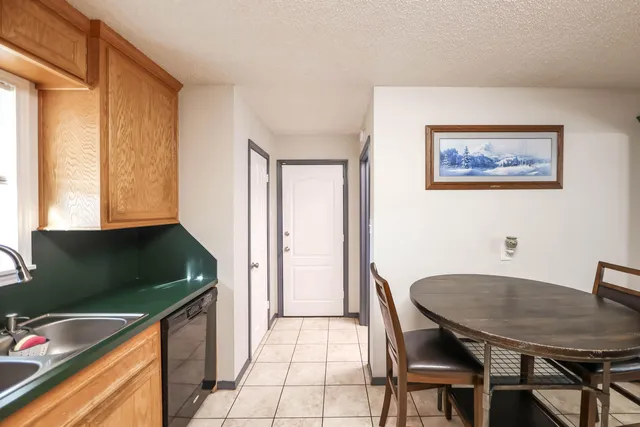 a kitchen with a table and chairs