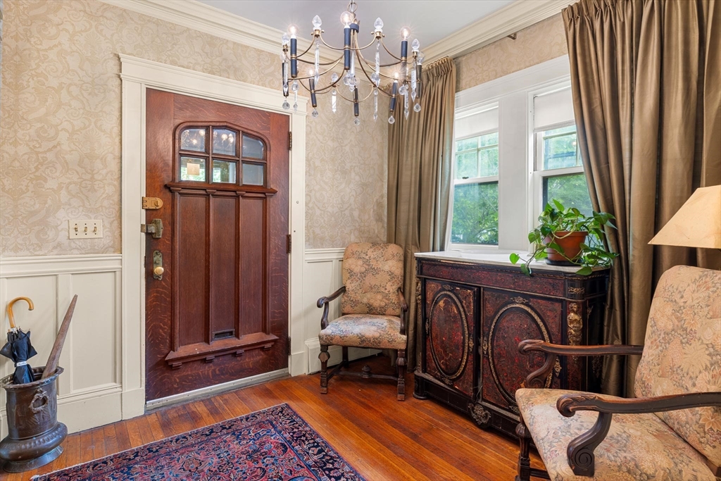 10 Evans Road Brookline, MA 02445 - Photo 2 of 10 a view of living room filled with furniture and a chandelier