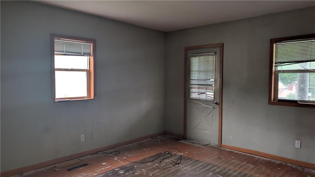 102 Moose Hill Road Millsboro, PA 15348 - Photo 5 of 11 a view of an empty room with wooden floor and a window