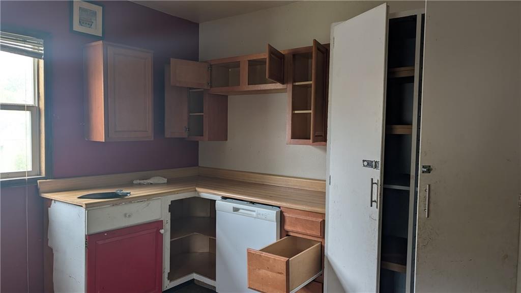 102 Moose Hill Road Millsboro, PA 15348 - Photo 6 of 11 a kitchen that has a sink and a stove